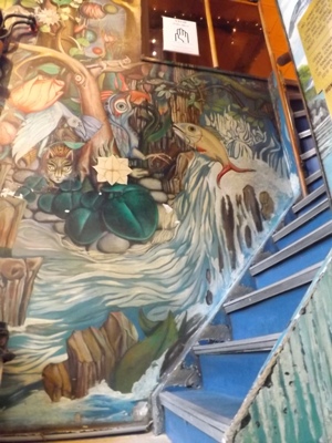 Jungle mural going upstairs at Bluebird Coffeeshop in Amsterdam