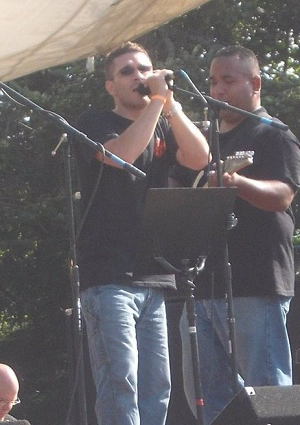 Russ Hudson performing at a benefit concert