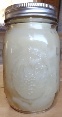 Jar of finished coconut cannabis oil