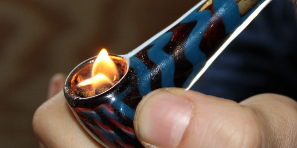Kieh hash on fire in glass pipe