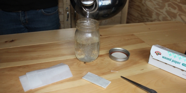 Pour hot water in mason jar