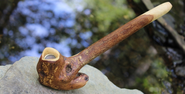 Large tribal pipe with blue water sparkles