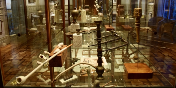 Display case of cannabis pipes at the Hash Museum BCN