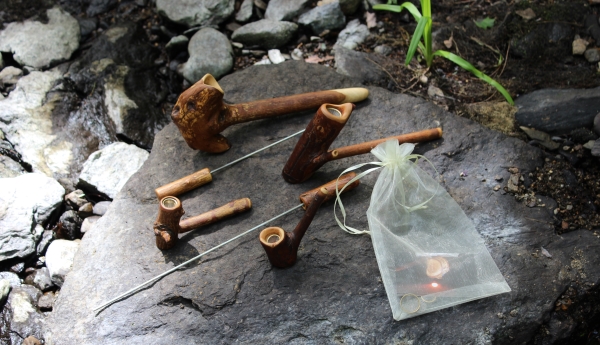 Group of Tribal Pipes on rock