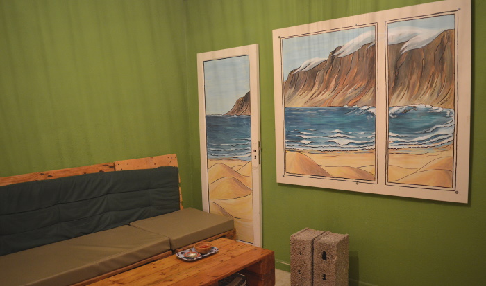 One of the walls inside Green In Door has a painting of Famara